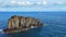 Beautiful sailboat on the background rocks in the atlantic ocean