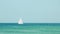 Beautiful sailboat passing by on gorgeous ocean waters