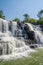 Beautiful Sala water falls near Labe with trees, green pool and a lot of water flow, Guinea Conakry, West Africa