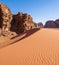 beautiful sand dune in the background of cliffs in the Wadi Rum Desert