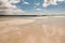 Beautiful sand of Gurteen beach, county Galway, Ireland. Warm sunny day. Cloudy sky. Nobody. Irish landscape