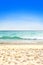 Beautiful sandy beach against blue sky