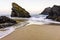 Beautiful sandy beach with rocks on Atlantic coast, Portugal