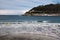 Beautiful sandy beach in san sebastian with monte urgull, spain