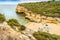 Beautiful sandy beach surrounded with cliffs called Barranco, Algarve, Portugal