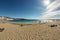 Beautiful sandy beach in the tourist resort Playa de las Americas. Super wide angle panoramic view. Clear sunny day with very few