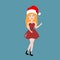 Beautiful santa claus girl in red hat and dress