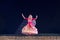 Beautiful Sattriya Dancer performing Sattriya Dance on stage at Konark Temple, Odisha, India..A assamese classical indian dance