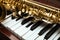 Beautiful saxophone on piano keys, closeup. Musical instruments