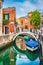 Beautiful scene with colorful houses and boats in Venice