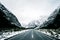 Beautiful scene of empty road to Milford sound after snow. I