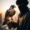 Beautiful scene of a falcon seated on falconer\\\'s gloved hand