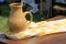 Beautiful scene of Handcrafted pottery pitcher on yellow and white kerchief