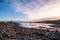 Beautiful scene of a landscape in a rural area beside the ocean at sunset. Cosy Nook, New Zealand. I