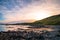 Beautiful scene of a landscape in a rural area beside the ocean at sunset. Cosy Nook, New Zealand. I