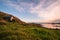 Beautiful scene of a landscape in a rural area beside the ocean at sunset. Cosy Nook, New Zealand. I