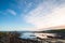 Beautiful scene of a landscape in a rural area beside the ocean at sunset. Cosy Nook, New Zealand. I