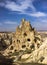 Beautiful scene of a rocky sunny hill against a blue sky in Goreme Open Air Museum in Turkey