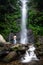 Beautiful scene of Semirang Waterfall with lovely smooth water. A man standing and enjoying a gorgeous waterfall. A Waterfall