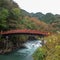 Beautiful scene of Shinkyo bridge, The World Heritage Sites, with refreshing trees and flowing river for background