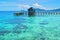 Beautiful scene of wooden pier above coral reef  - Arborek village,  Raja Ampat, West Papua, Indonesia