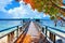 Beautiful scene of wooden pier above coral reef - Arborek village, Raja Ampat, West Papua, Indonesia