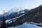 Beautiful sceneric view of Caucasus mountain. The way to mountain with pine forest covered with snow in winter season at Mestia