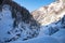 Beautiful sceneric view of Caucasus mountain. The way to mountain with pine forest covered with snow in winter season at Mestia