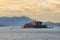 Beautiful scenery of Alcatraz island or "The Rock" under the pinky cloudy sky in San Francisco Bay