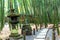 Beautiful scenery of bamboo forest and the old stone lamp in Hokokuji temple