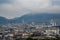 Beautiful scenery of Beppu cityscape with Steam drifted from public baths and ryokan onsen. Beppu is one of the most famous hot sp