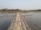 Beautiful scenery of close view river bamboo bridge