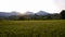 Beautiful scenery in the countryside at sunrise with green rice fields and mountains