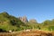 Beautiful scenery of green forest, field and smooth rocks