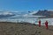 Beautiful scenery of lagoon Fjallsarlon glacier VatnajÃ¶kull 2 persons going for boat ride sunny day Iceland