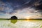 Beautiful scenery lonely abandon house in the middle of paddy field with magical color sunrise and dramatic cloud