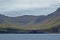 Beautiful scenery of Mulafossur Waterfall Goose valley and Gasadalur village view from water. Vagar island Faroe is