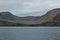 Beautiful scenery of Mulafossur Waterfall Goose valley and Gasadalur village view from water. Vagar island Faroe is