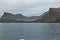 Beautiful scenery of Mulafossur Waterfall Goose valley and Gasadalur village view from water. Vagar island Faroe is