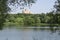 Beautiful scenery of multistorey building in the park on the bank of the river