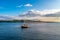 Beautiful scenery of a small sailboat on the river and a cloudy sky, Tay in Scotland