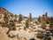 Beautiful scenery of stacks of stones at a bach in mi Fontes, Portugal