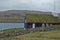 Beautiful scenery with typical house with grass roof near sea. Faroe Islands