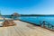 Beautiful scenery of a wooden resort dock on the beach on a sunny day