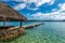 Beautiful scenery of a wooden resort dock on the beach on a sunny day