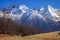 Beautiful scenic blue sky sunny autumn landscape of snowy Main Caucasus Ridge in Caucasus Nature Reserve in Krasnaya Polyana, Soch