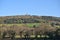 Beautiful scenic bright distant view of Ballycorus lead mining and smelting chimney tower and old trees seen from Ballycorus Road