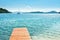 Beautiful scenic landscape with a boat in the bay and a wooden pier near Nydri, Lefkada, Greece. Stunning amazing charming places