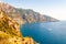 Beautiful scenic landscape of Positano. Rocky coastline full of boats and yachts traveling near high mountains. Cityscape of