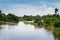 Beautiful scenic landscape view in rural calm flowing lake in Sri Lanka, Galle, Hapugala. blue skies and trees reflect on the